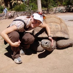A photo of me next to a Galapagos tortoise at the Phoenix Zoo.
