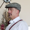 Picture of Professor Daniel Nearing with an old style hat, white shirt and suspenders. 