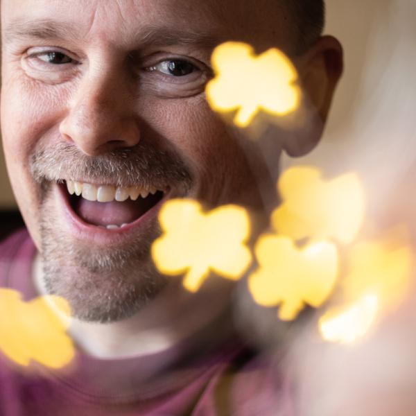 Photo of Mark with four lead clover shaped lights